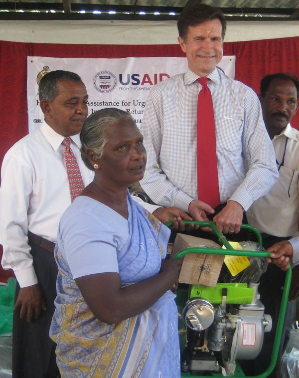 Assistant Secretary Blake handing over a water pump to a beneficiary of a program jointly conducted by the United States, the United Nations, and the Government of Sri Lanka in Killinochchi.