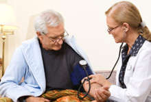 Picture of a health care professional caring for a cancer patient.