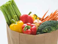 paper bag full with vegetables