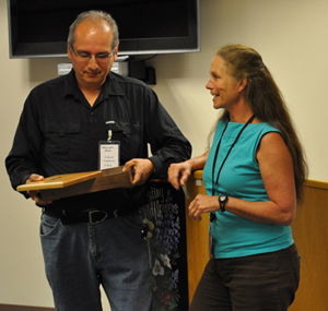 Photograph: Jim Archuleta (left), Soil Scientist on the Umatilla National Forest, is congratulated by Karen Bennett, Region 6 Soils Program Manager, upon receiving the 2011 Field Soil Scientist of the Year award.  Posting permission given by individuals.