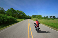 Photo: Man riding on motorcycle
