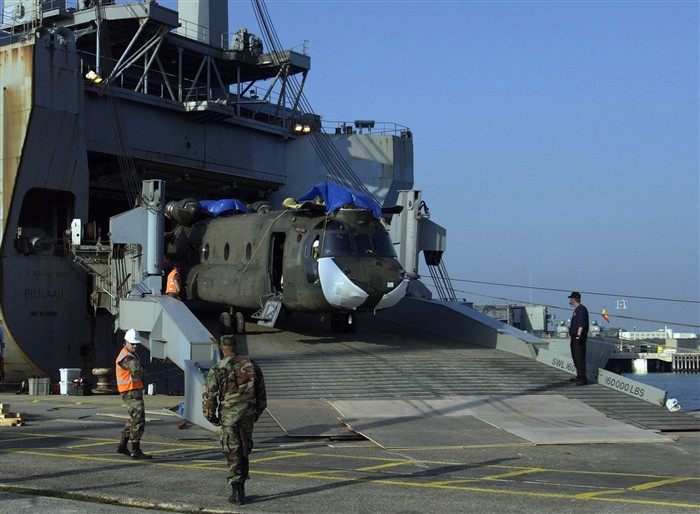 ROTA, Spain &mdash; An Army CH-47 Chinook helicopter is offloaded from the USNS Pililaau here Feb. 13, 2006, for transport via an Air Force C-17 Globemaster III aircraft to another location. (DoD photo by Air Force Senior Airman Nichole Adamowicz)