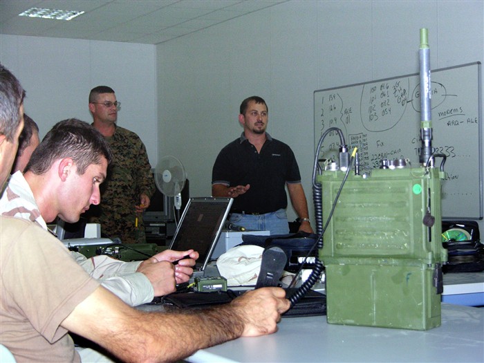 KRTSANISI, Georgia &mdash; Marine Gunnery Sgt. Nathan Guidry, standing on left, and retired Marine Gunnery Sgt. David Moose, standing on right, train 16 Republic of Georgia soldiers to be communications trainers Sept. 26 here. Guidry is the communication chief for U.S. European Command’s Georgia Sustainment and Stability Operations Program, or GSSOP; Moose is a technical trainer from the Harris Corporation. The GSSOP-trained 22nd Light Infantry Battalion troops are part of the dedicated force called for in U.N. Security Council Resolution 1546 to protect U.N. forces serving in Iraq. (DoD photo by Marine Staff Sgt. Jonathan Moor)