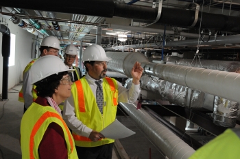 Acting Deputy Blank shown on tour with mechanical equipment