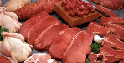 Photograph of cut pieces of red meat and chicken.