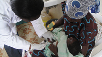 Cild getting a malaria vaccination