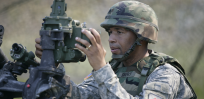 U.S. Army Field Artillery Sergeant Sibert making adjustments