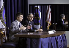 Locke and Chu seated at table responding to auidence questions. Click for larger image.