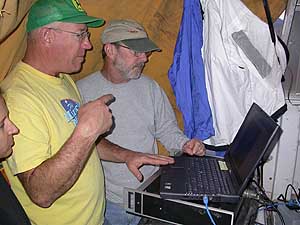 Steve Hiebert, retired Biologist and 86-69290 Group Manager (left) and Dr. Paul Marsh, Arizona State University (right) examine the DIDSON output on a laptiop computer.