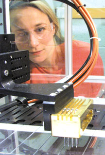 Julie Stair watches the Cartesian  Technologies gene-chip maker go through a test run