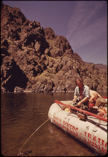 DOCUMERICA: MEMBERS OF SNAKE RIVER RAFT TRIP CATCH SMALLMOUTH BASS IN HELLS CANYON, 05/1973 Boyd Norton
