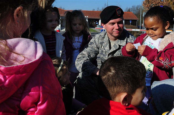 VILSECK, Germany &mdash; Air Force Senior Airman Truman Smith, 2nd Air Support Operations Squadron Tactical Air Control Party member, helps a group of children figure out a land navigation clue during the child development center&#39;s &#34;Boot Camp Week&#34; at Rose Barracks, Vilseck Military Community, Germany, April 7. Members of the squadron participated in the &#34;Boot Camp Week&#34; which gave service member&#39;s children an opportunity to experience some military norms such as physical training, first aid, land navigation and tactical vehicle familarization in support of the Department of Defense&#39;s Month of the Military Child. (U.S. Air Force photo by Senior Airman Tony R. Ritter) 
