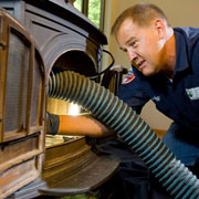 image of a chimney sweep at work