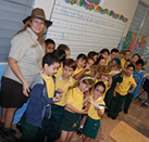 Public Affairs Specialist with first graders during outreach at school