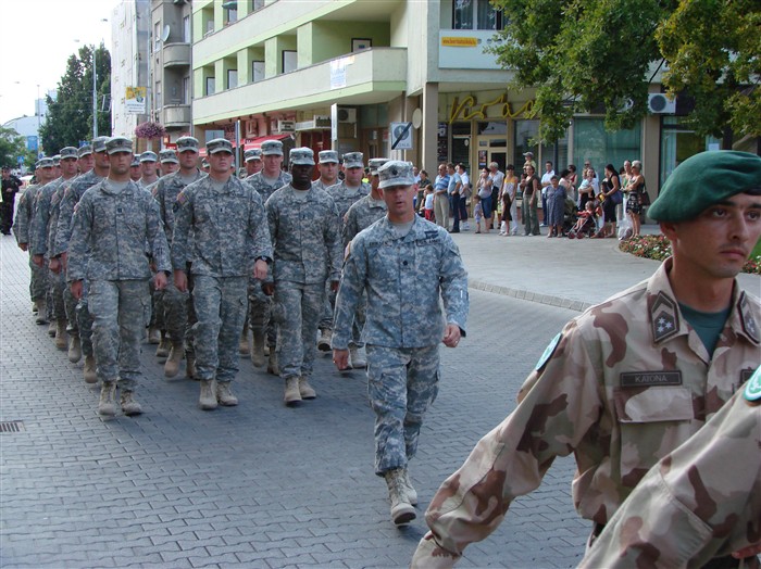 SOLNOK, Hungary &mdash; Ohio National Guard and Hungarian troops march down the main city street here during the Operational Mentor and Liaison Team (OMLT) homecoming ceremony Aug.15. The team spent the last year working together with Hungarian soldiers training the Afghan National Army forces. (Department of Defense photo by 1st Lt. Nicole Ashcroft)