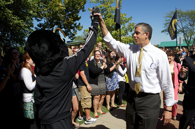 Duncan high fives Corky the Hornet at Emporia