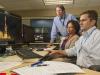 Paul Doyle, right, Yvette Binford, center, and Ken King integrate and debug the SLS avionics software.