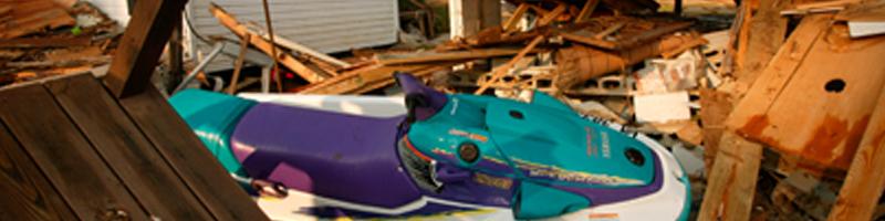 September 18th, 2003. A jet ski sits on top a pile of debris.