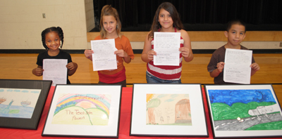 Four children display their art