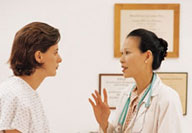 Doctor talking to woman