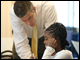 Through Horton's Kids, a nonprofit organization that serves more than 200 children living in Anacostia, Department employees, shown here with the Secretary, tutor students from some of of D.C.'s neediest schools every week for an hour.