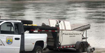 Neosho National Fish Hatchery staff prepare to stock Federally endangered pallid sturgeon.