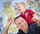 Photo: Dad carrying son on his shoulders