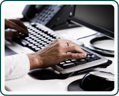 A man using a computer keyboard.