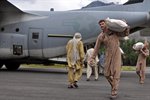 U.S. Marines, Pakistani Locals Unload Supplies