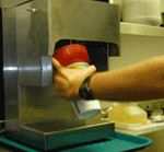Securely hold shake cup container on mixer blade