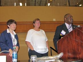 Picutre of Sherry Brown, center, received an award for her contributions over the years to the TB Workshop.