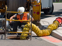 Utility worker working on sewer line