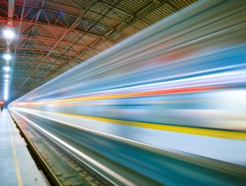 Image of high-speed rail with multi-colored streaks