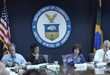 Image of Locke and participants seated at table. Click for larger image.