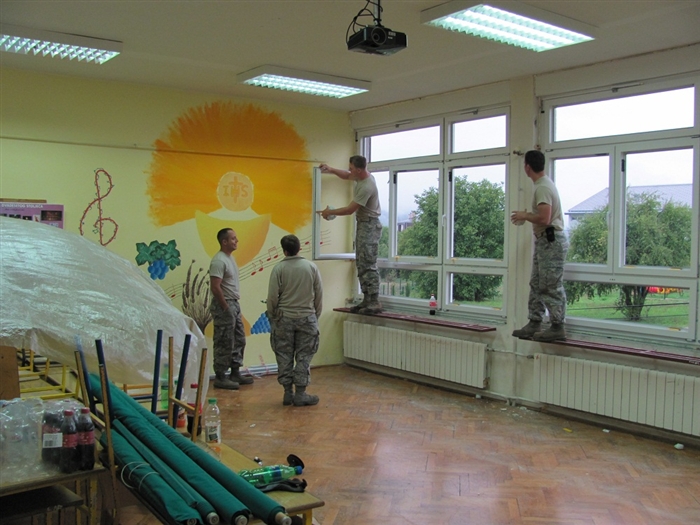 Air National Guard conducts annual training installing new  energy efficient windows at Slunj elementary school part of a Humanitarian Civic Assistance project.