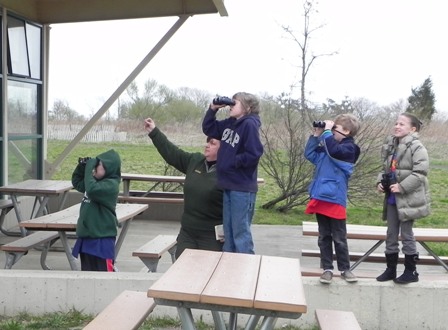 Park Ranger Geri Kobryn-Blatter points out geese, brant and other birds at Junior Rangerpalooza, held at Great Kills Park, Staten Island Unit.