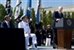 Defense Secretary Robert M. Gates addresses the audience while President Barak Obama and Navy Adm. Mike Mullen, chairman of the Joint Chiefs of Staff, look on during the Armed Forces Farewell Tribute to honor Gates at the Pentagon, June 30, 2011. DOD photo by Cherie Cullen