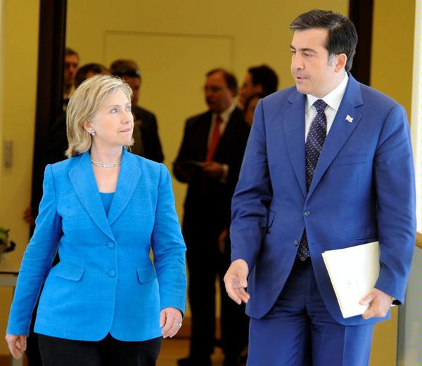 Secretary Clinton and President Saakashvili approach the President's office.

