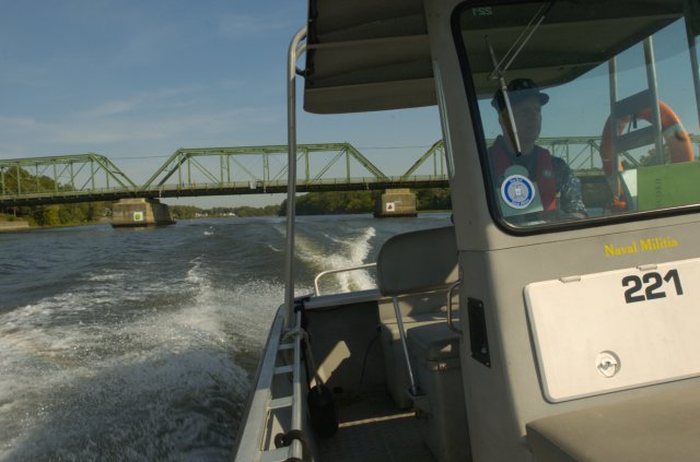 New York Naval Militia Commander Don McKnight cons Naval Militia Patrol Boat 221 up the Hudson River during a mission conducted Sept. 14, 2012, at Troy, N.Y., as part of a joint domestic operations training exercise.