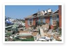 An image of a house that has been through a disaster.