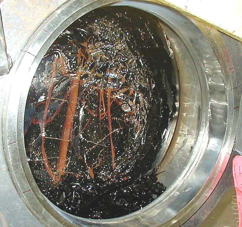 View into the mouth of a prototypic (full-scale) canister filled with glass made from HLW simulant.  An identical canister was used in drop testing to demonstrate the compliance with Federal requirement for canister integrity