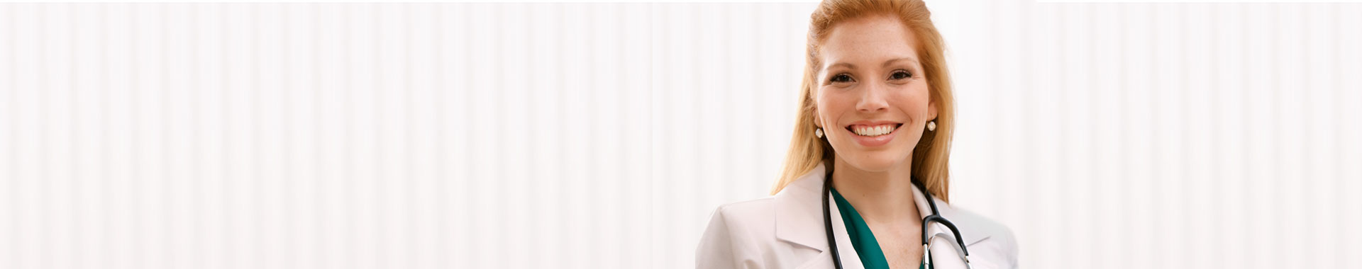 Smiling woman doctor in a lab coat