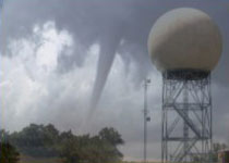 NEXRAD Doppler radar with tornado in background