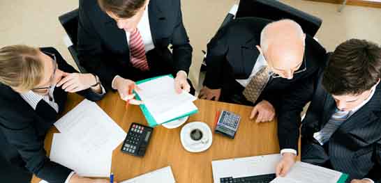 Vendors at work discussing at the meeting table