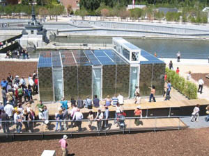 Photo of people waiting and relaxing on the decks of the Stuttgart house. 