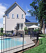 House with fence around pool