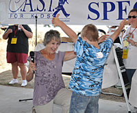 photo: Assistant Secretary for Water and Science Anne Castle and child at C.A.S.T. for Kids fishing event