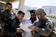 U.S. Navy Lt. Jerry Mojzis, right, and Lt. David Berlin go over design plans with a local doctor during a mission to Pur Chaman district, Farah province, Afghanistan, Sept. 26, 2012. The mission marks the first time coalition forces have been to the Pur Chaman district in more than a year.  U.S. Air Force photo by Staff Sgt  Jonathan Lovelady