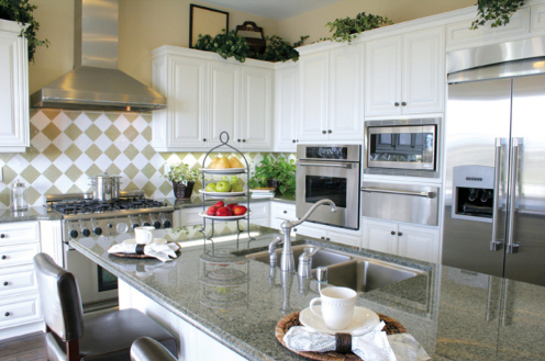 Photo of a kitchen with stainless steel appliances.