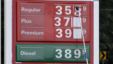 A man changes fuel prices at a ConocoPhillips gas station in Little Rock, Ark. The price of oil fell to its lowest point in nearly two months. U.S. consumer confidence slow, encouraging, Sept. 26, 2012